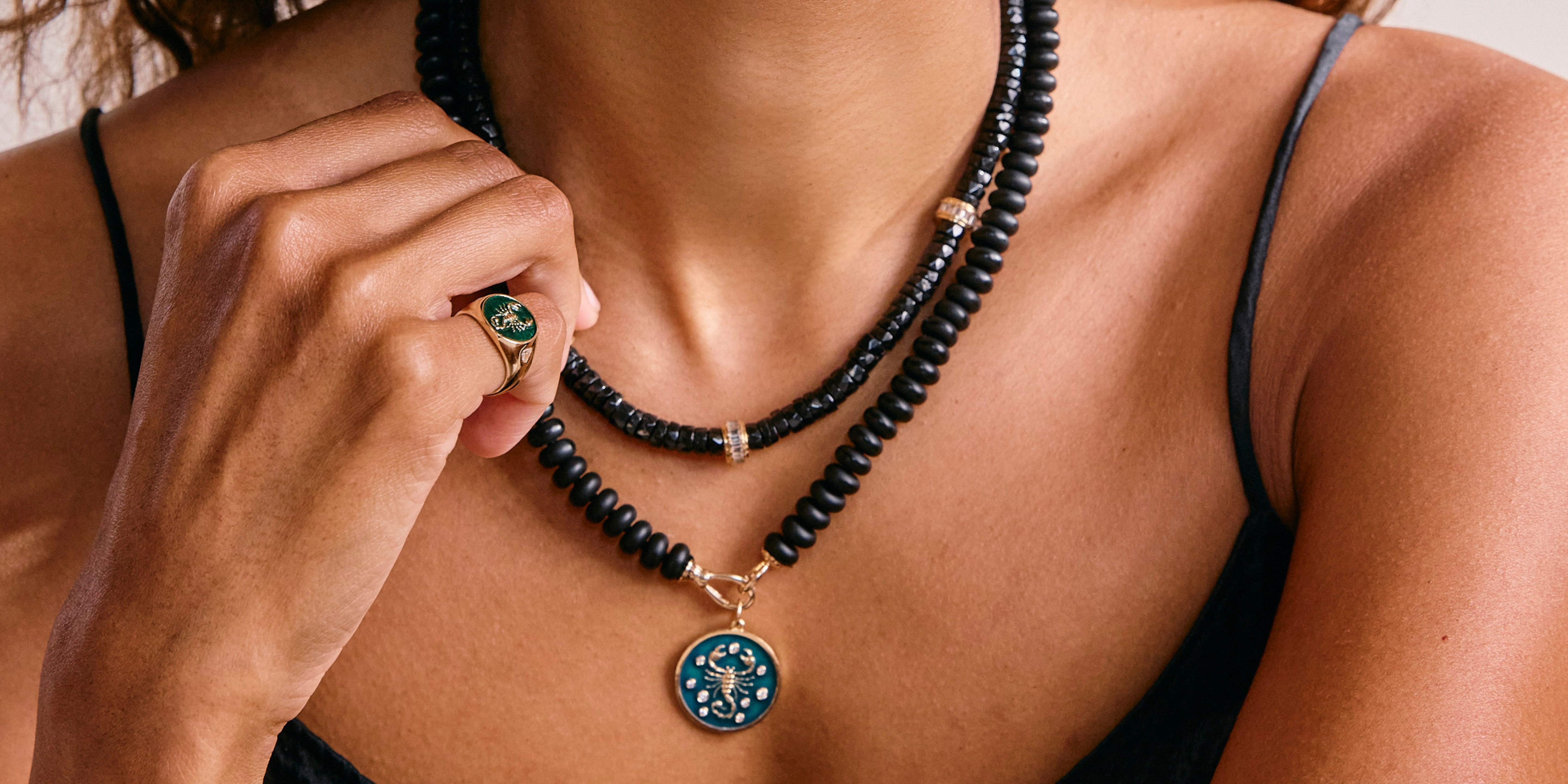 Model wearing Black Onyx Jewelry around her neck as a symbol of protection