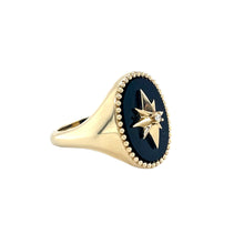 Load image into Gallery viewer, Black Onyx Starburst Signet Ring angled view with 14k gold band and diamond starburst detail on white background