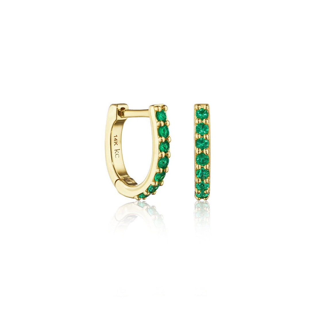 Gold hoop earrings with green gemstones on a white background