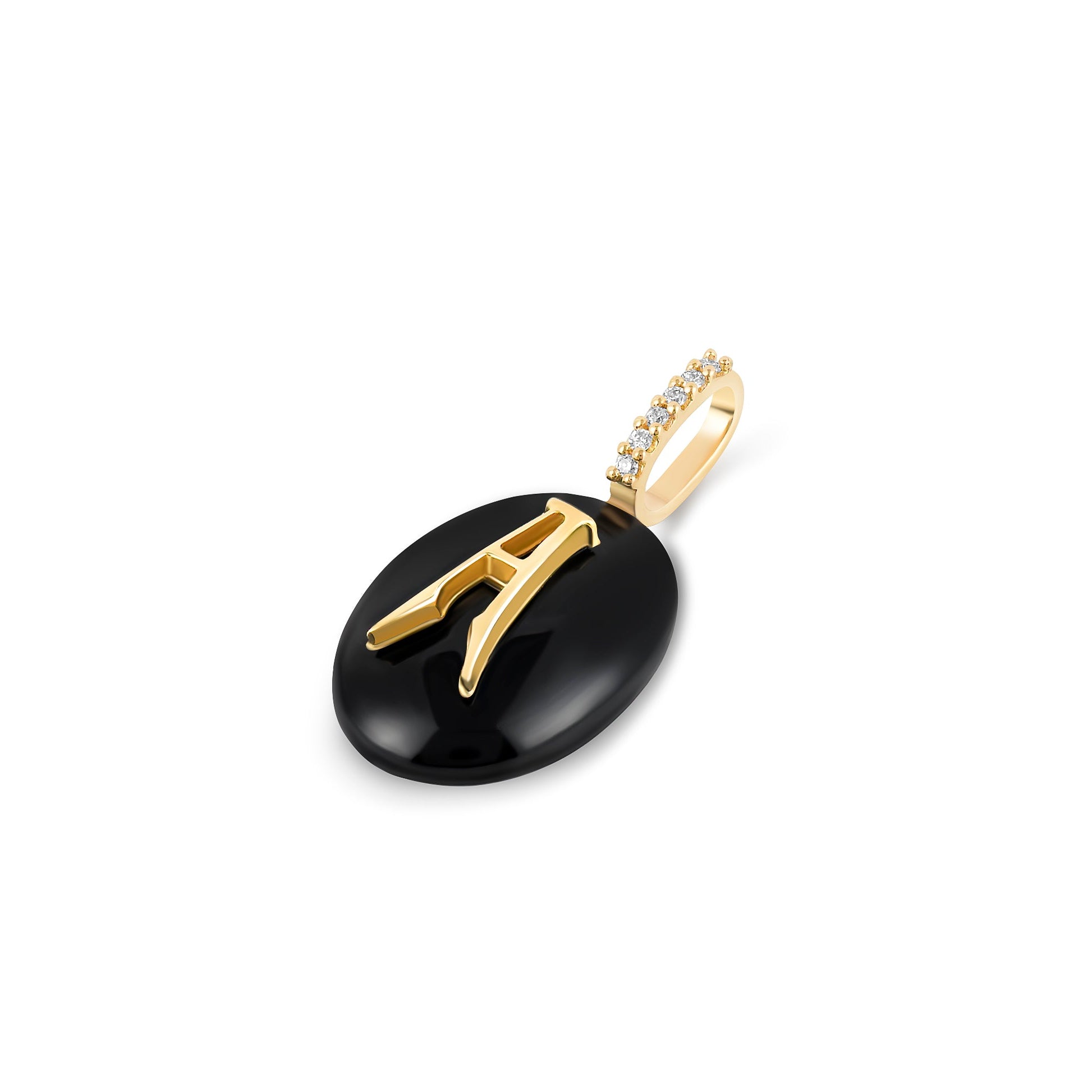 Angled view of small oval black onyx monogram pendant in 14k yellow gold with diamond bail