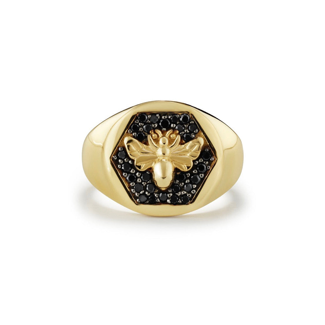 Gold ring with bee design and black stones on a white background