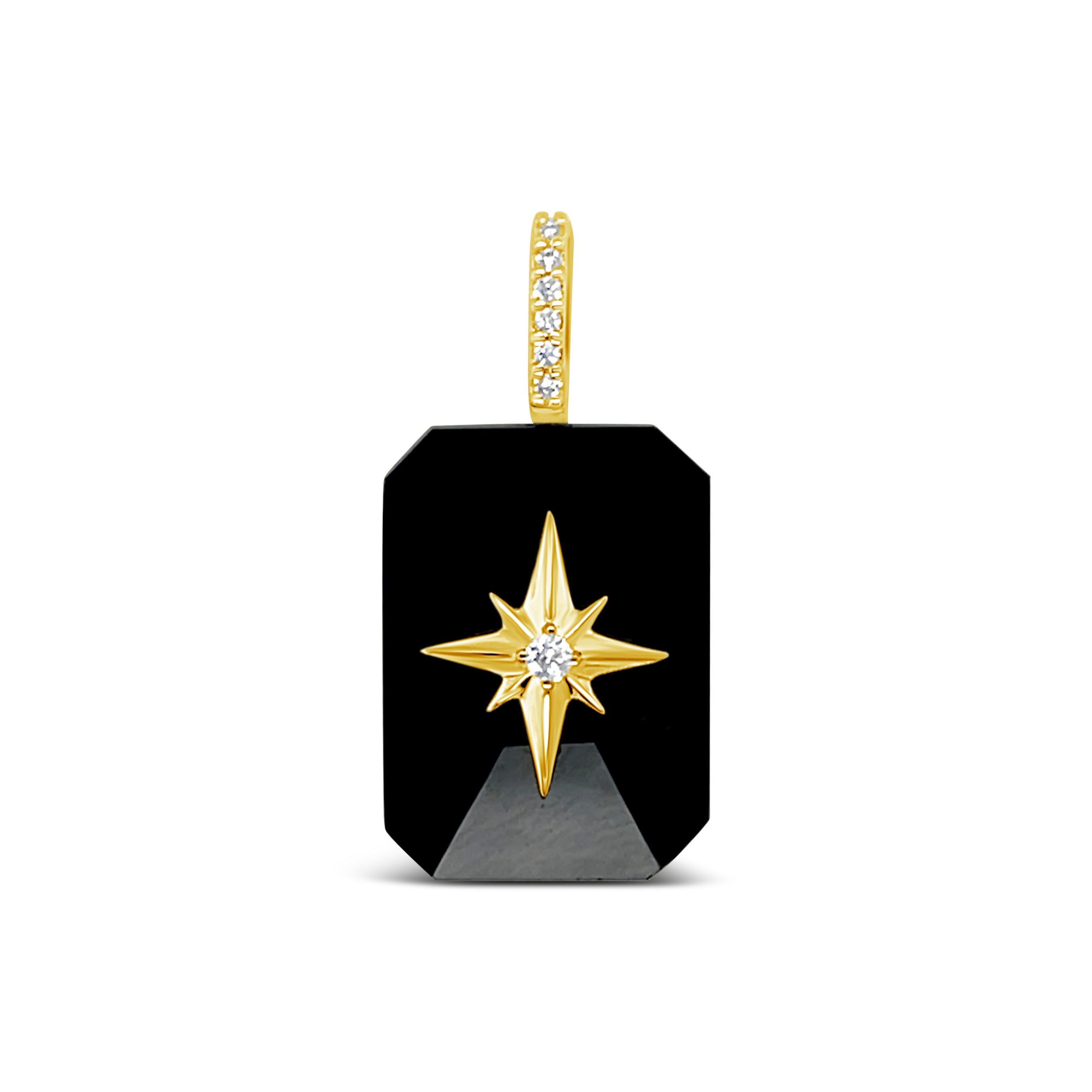 Black Onyx emerald-cut cabochon pendant with gold starburst and diamond bail on white background