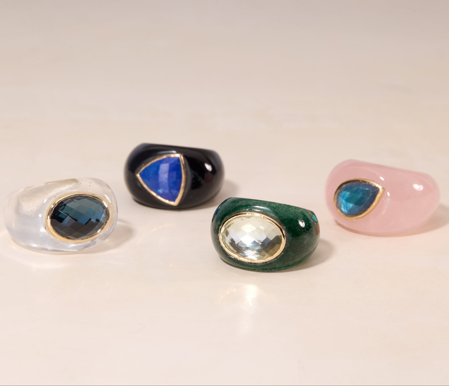 gemstone rings on flat surface