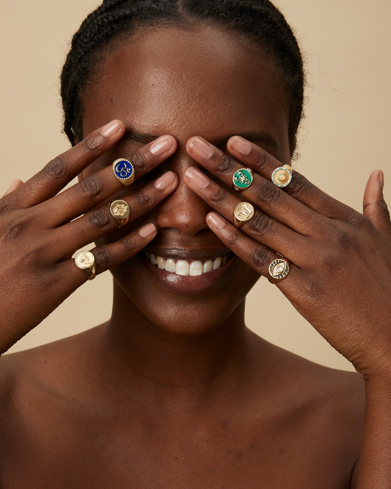 Model wearing signature symbol signet rings