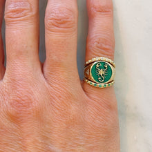 Load image into Gallery viewer, 14K Gold signet ring with an emerald green enamel and gold scorpion design detail. Paired with a White LG Diamond and Emerald half Eternity Contour Band
