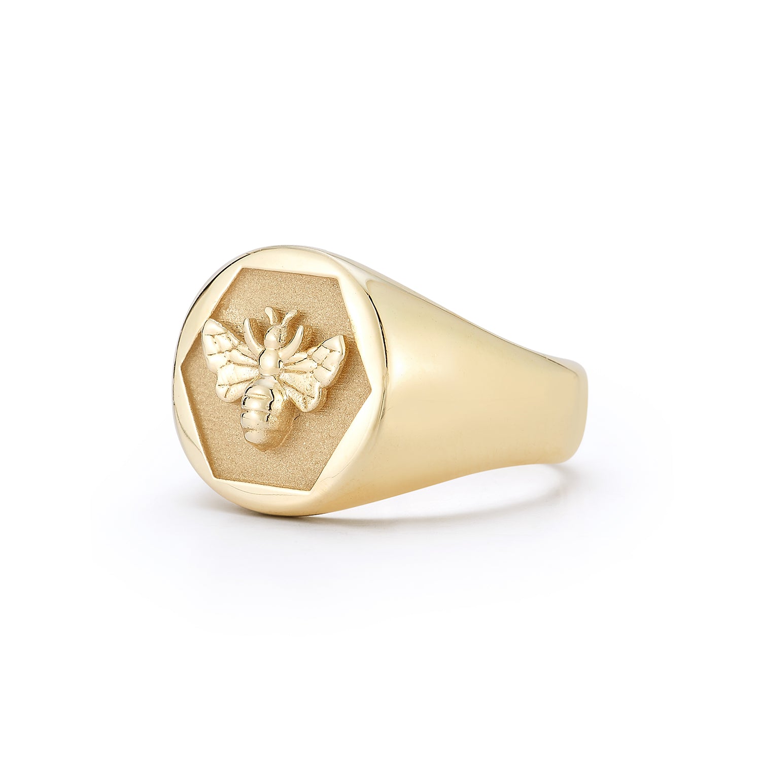 Angled view of the 14k gold Abundance Signet Ring showing detailed Queen Bee engraving