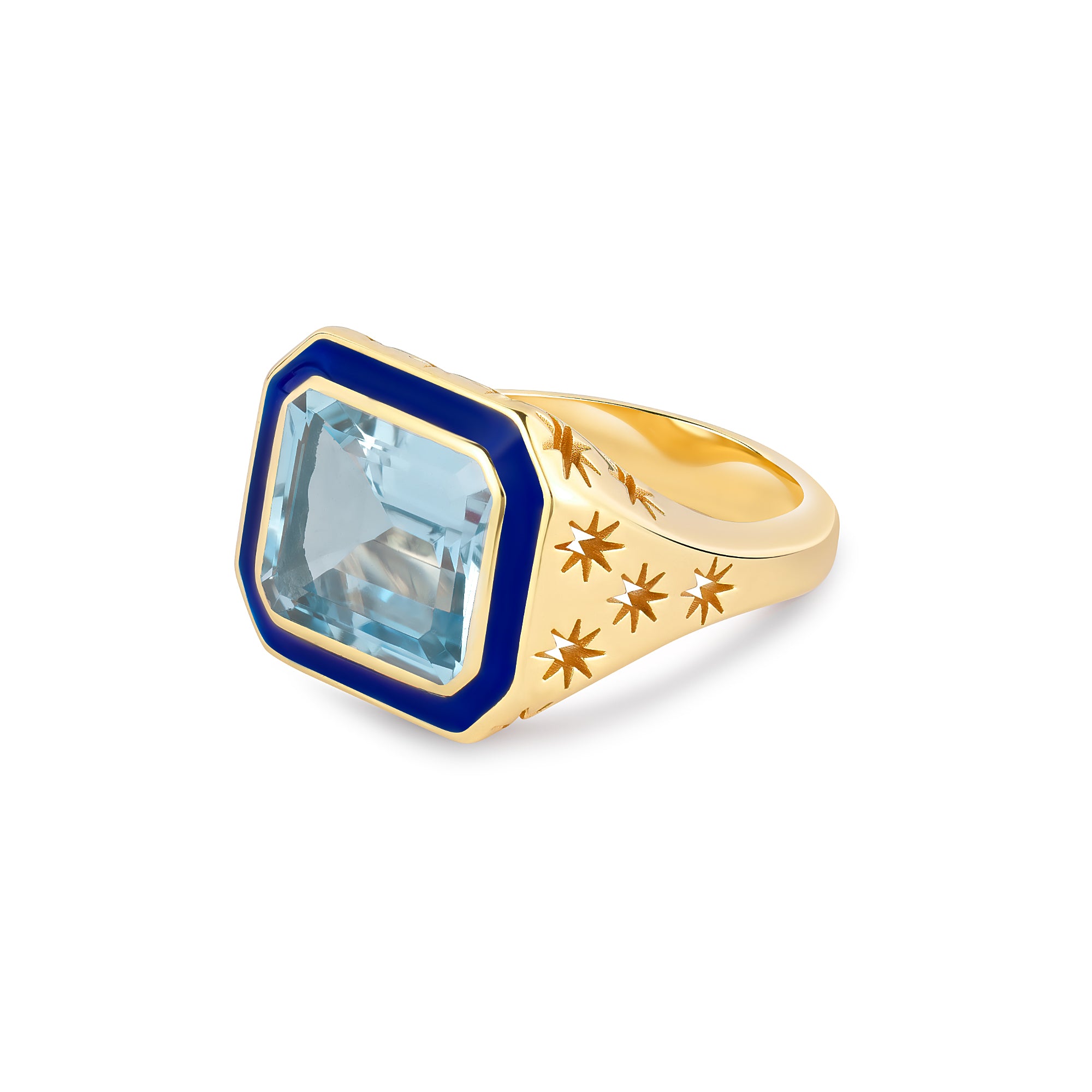 Side view of Starlit Ring showing star-engraved 14k gold shank and blue topaz stone